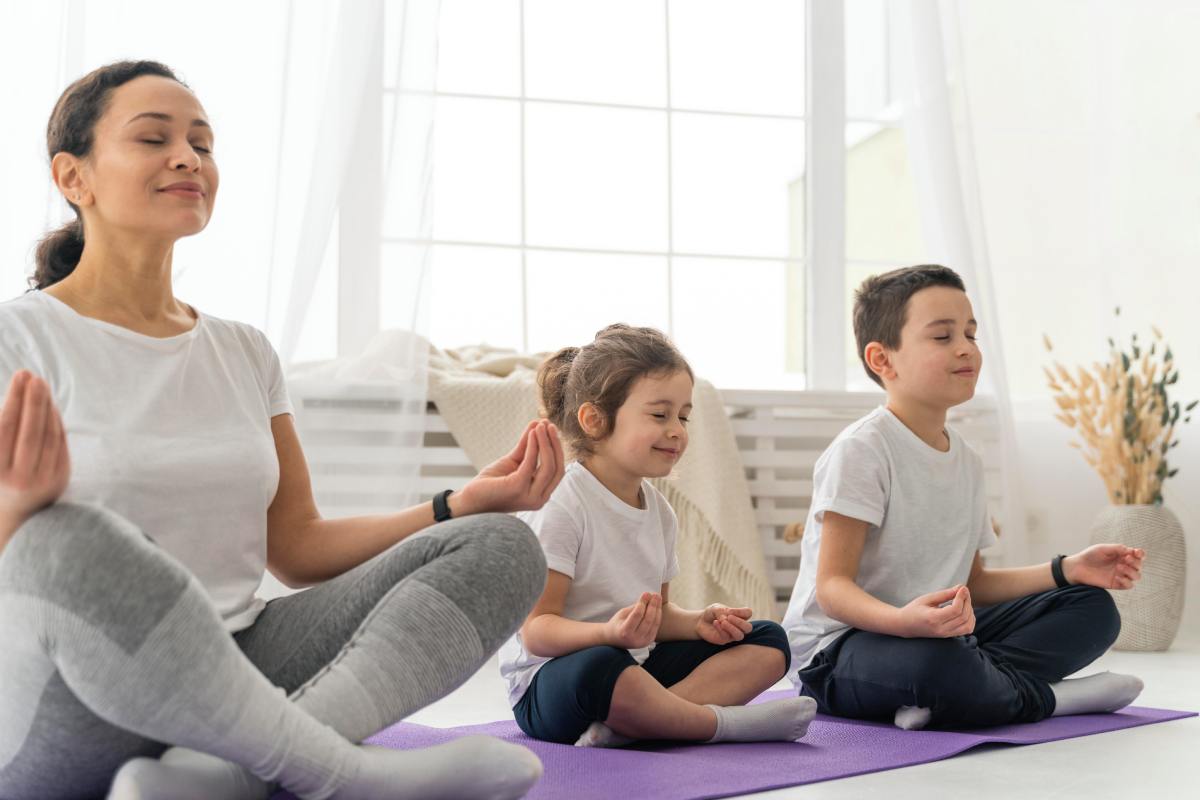 Family enjoys the yoga as fun activity