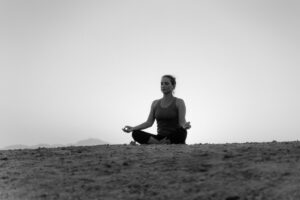 Woman doing a deep Meditation by following the 5 stages.
